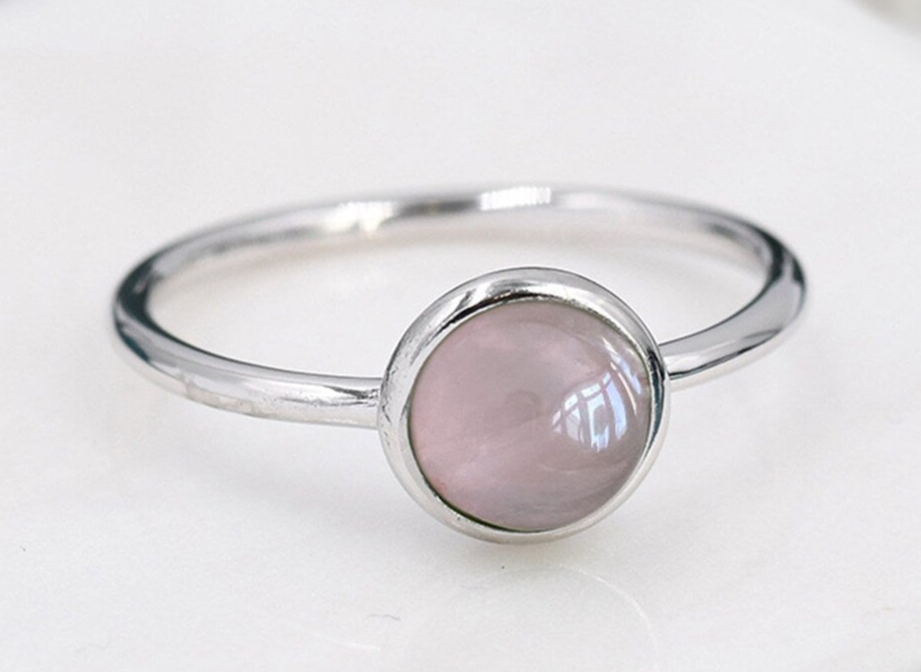 silver ring with a round cabochon with Rose Quartz